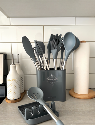 Gray silicone kitchen utensil set in a kitchen