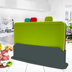 Four color-coded cutting boards in a gray holder