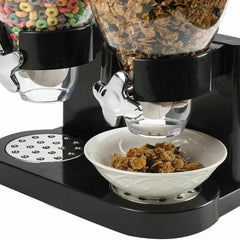 Black dual cereal dispenser serving cereal into a bowl