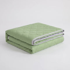 Folded Green diamond-quilted summer blanket