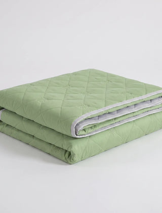 Folded Green diamond-quilted summer blanket