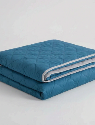 Folded Dark Blue diamond-quilted blanket