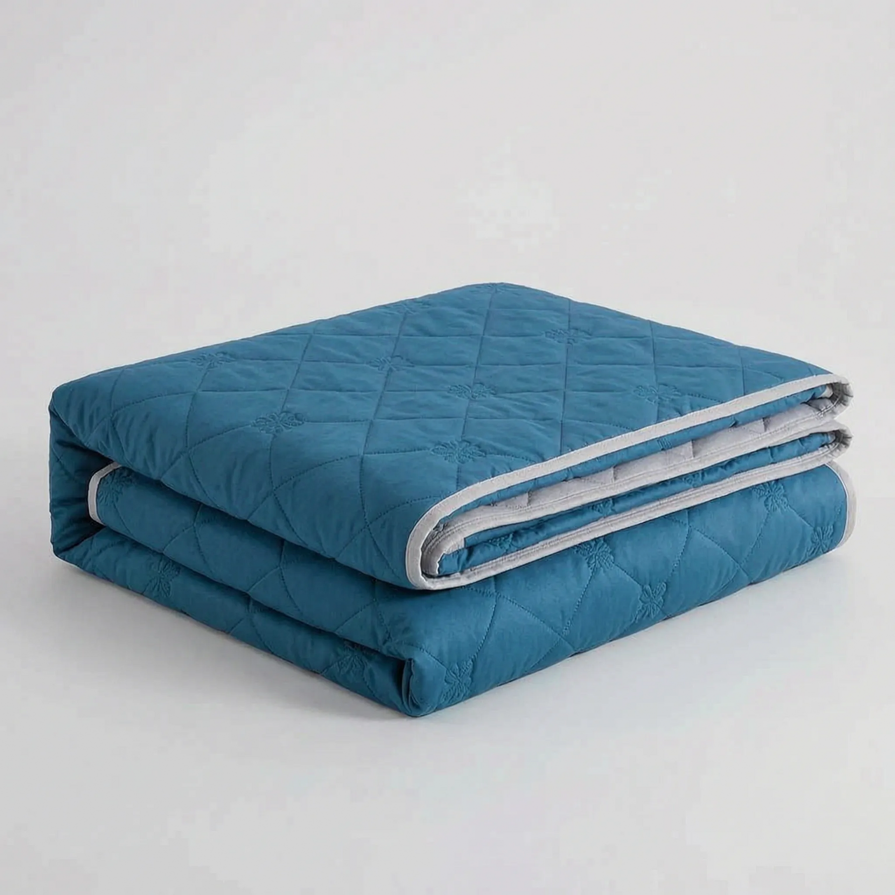 Folded Dark Blue diamond-quilted blanket