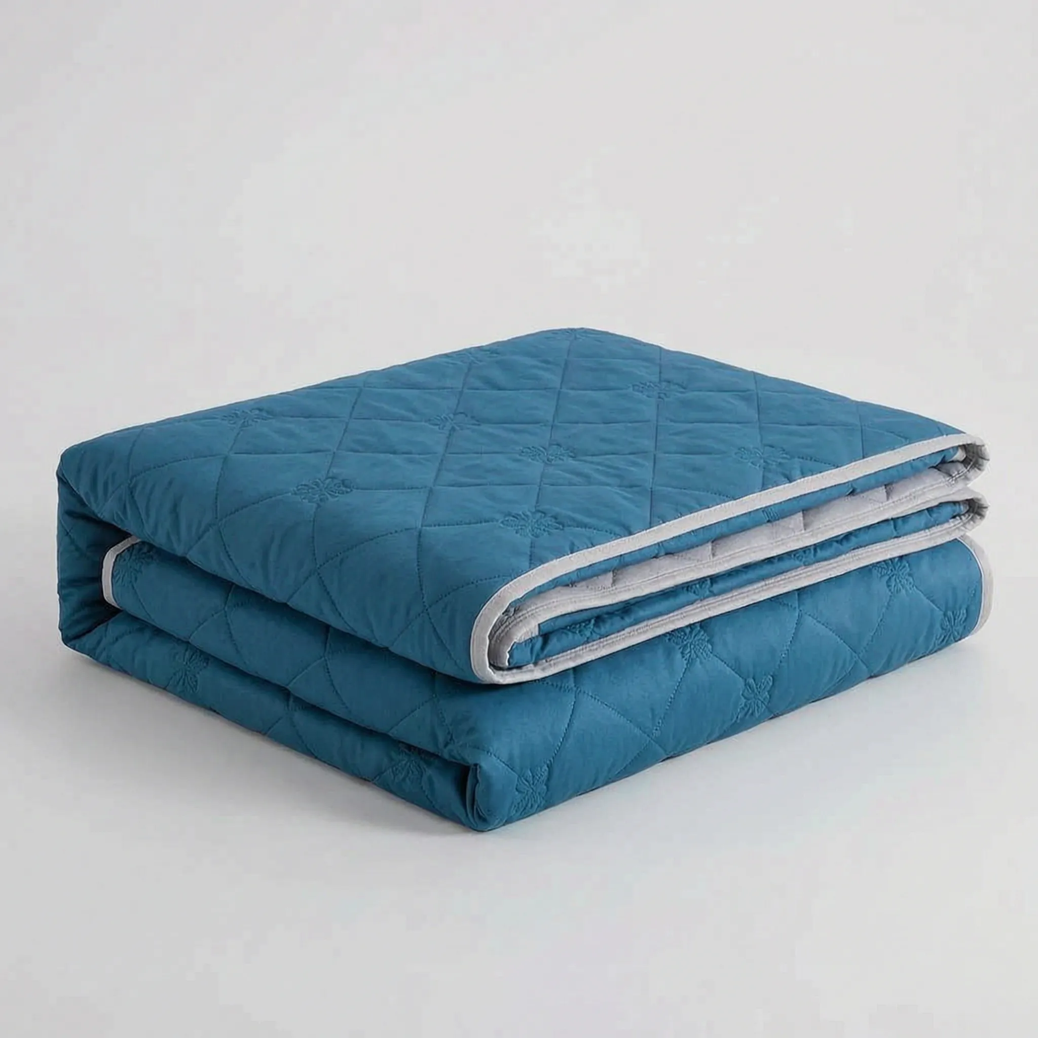 Folded Dark Blue diamond-quilted blanket