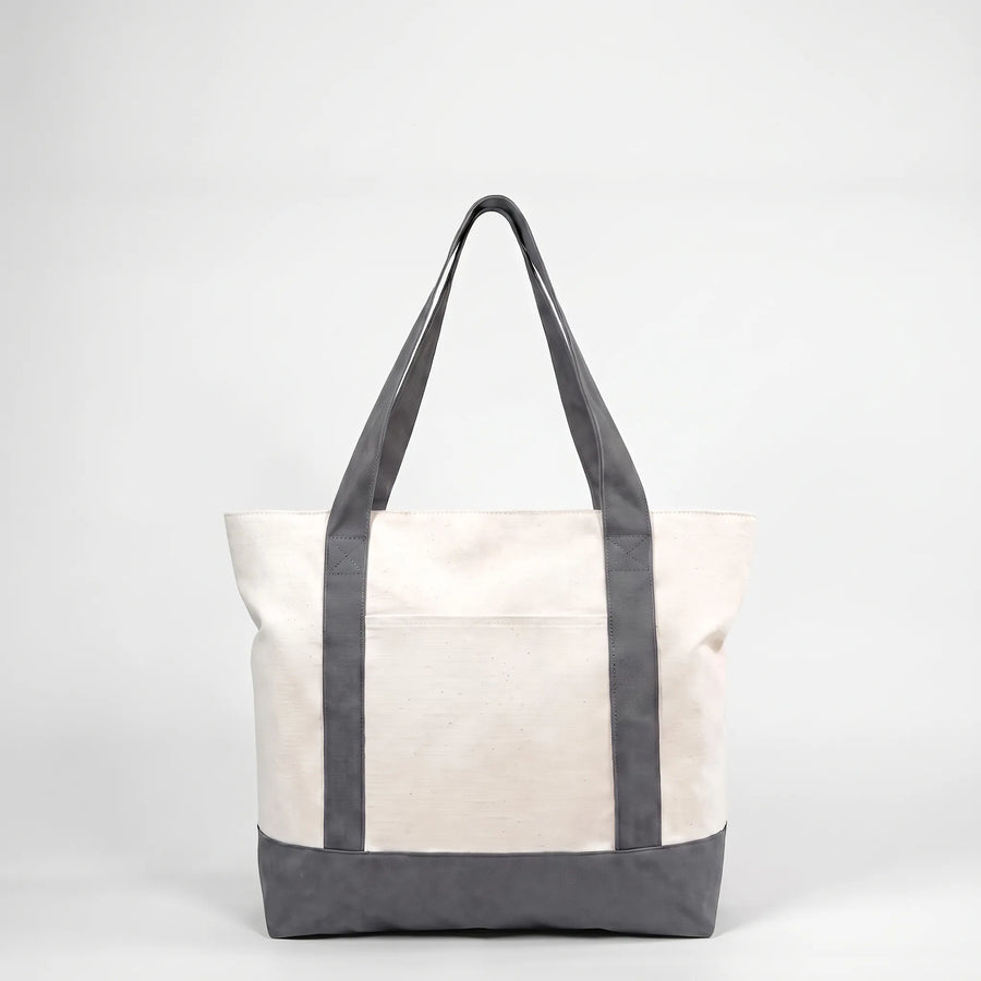 Gray canvas tote bag with exterior pocket