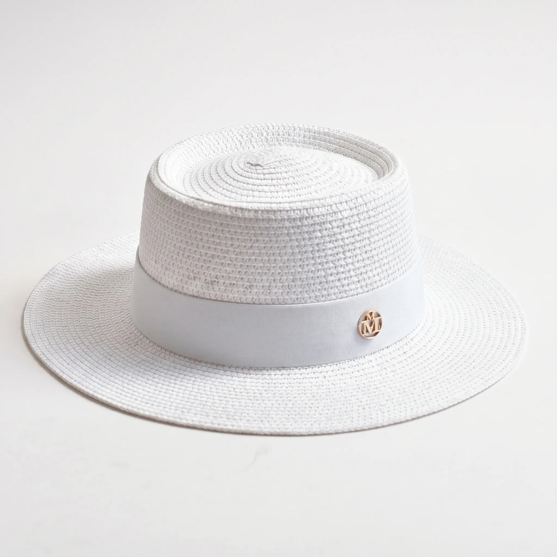 White flat-top woven sun hat