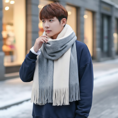 Beige and Gray fringed color-block knit scarf worn outdoors