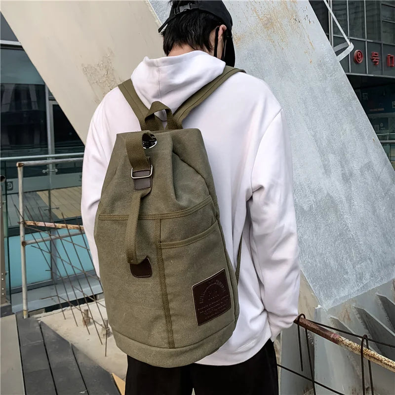 Army Green canvas rucksack worn outdoors