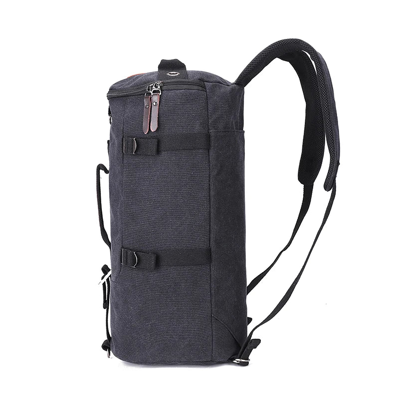 Side profile and compression straps on the Black canvas backpack