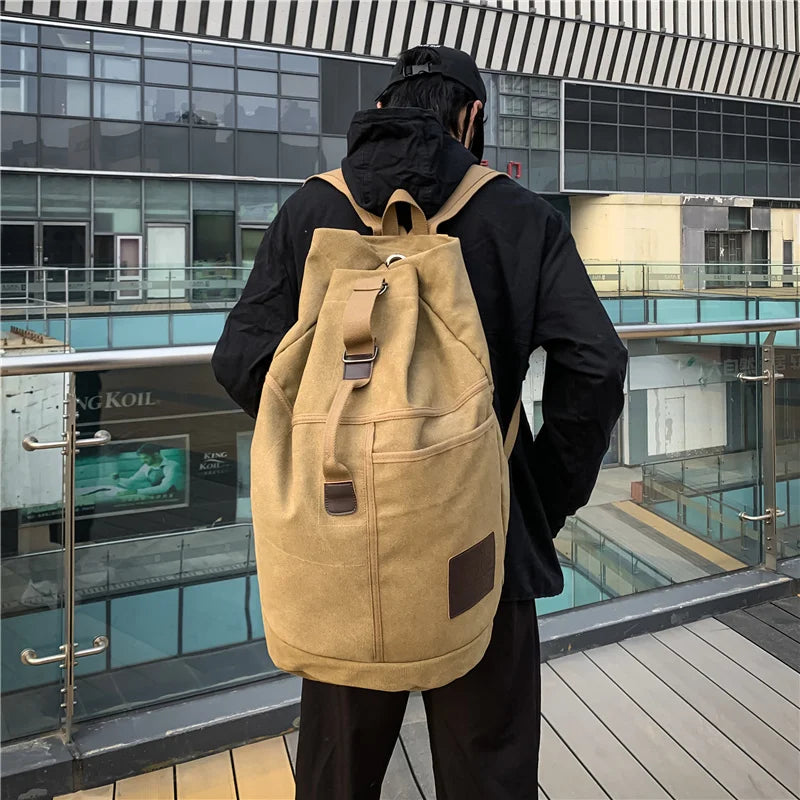 Khaki canvas rucksack worn outdoors