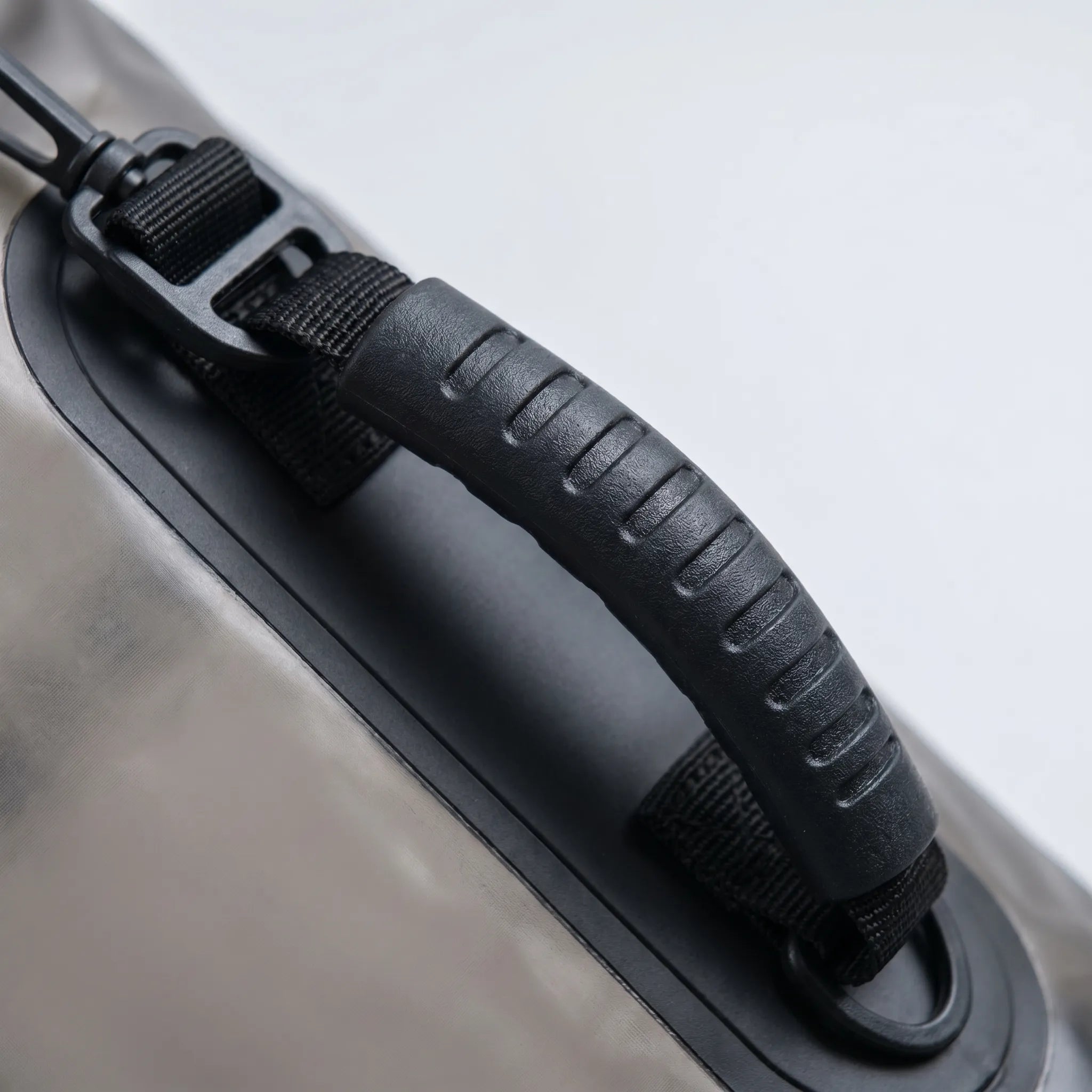 Close view of the carry handle and strap attachment