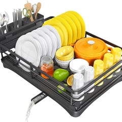 Black dish rack draining toward a sink