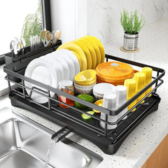 Black dish drying rack with plates, bowls, cups, and utensils