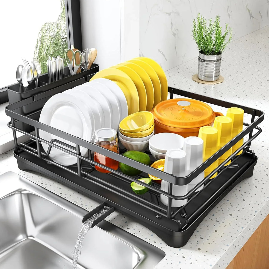 Black dish drying rack with plates, bowls, cups, and utensils