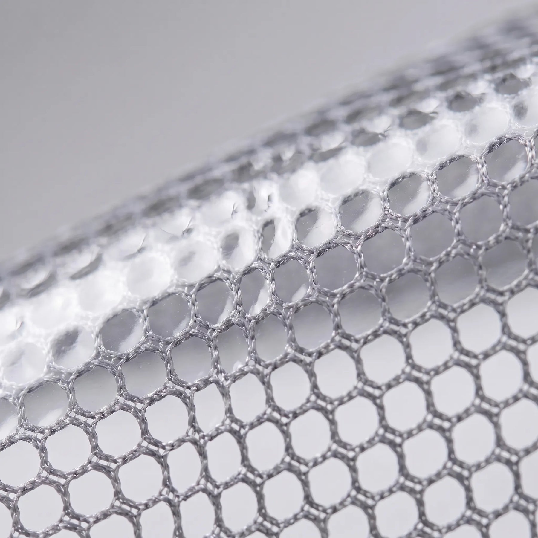 Close view of the mesh-look semi-transparent material