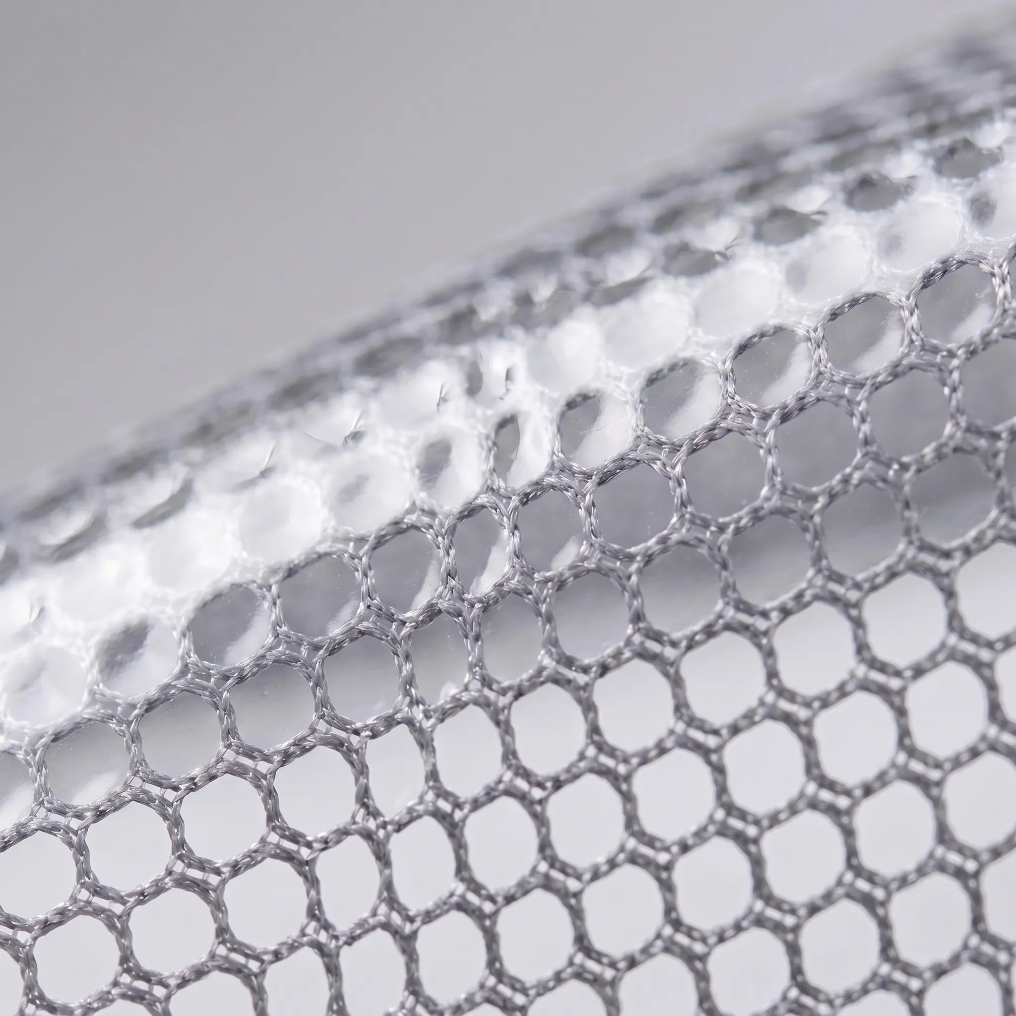 Close view of the mesh-look semi-transparent material