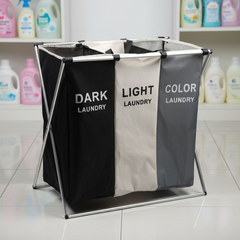 Three-section laundry sorting hamper in a utility room