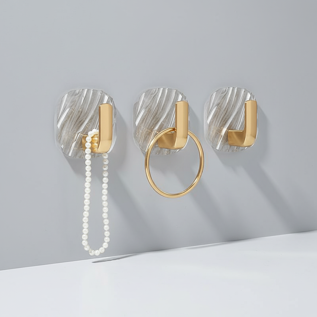 Three transparent acrylic wall hooks