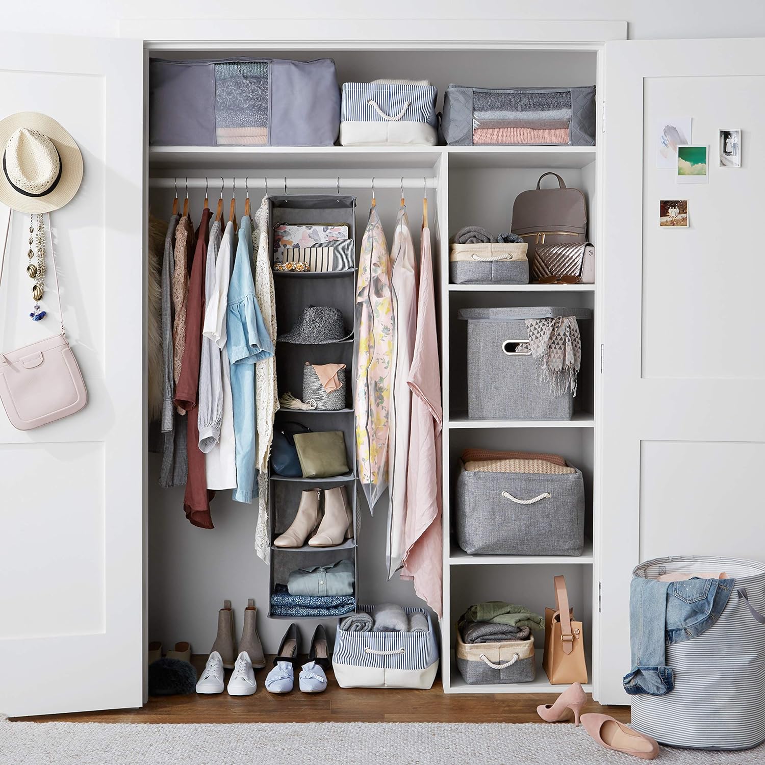 Garment storage bags organized inside a wardrobe