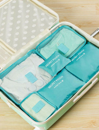 Blue packing organizer set inside a suitcase