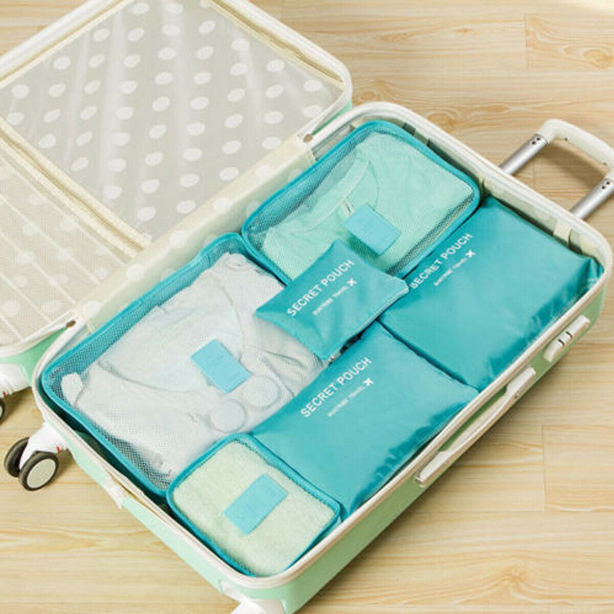 Blue packing organizer set inside a suitcase