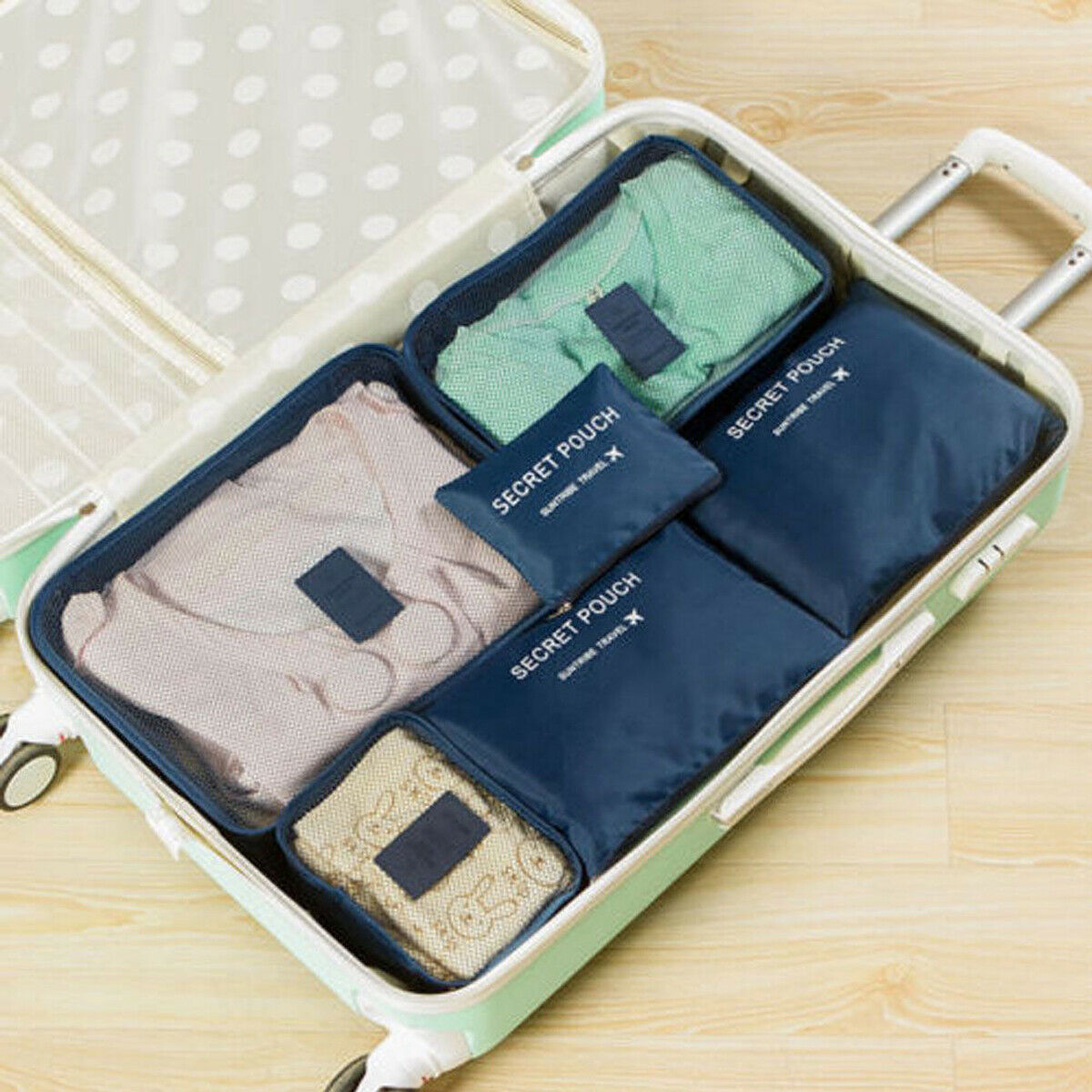 Dark Blue packing organizer set inside a suitcase