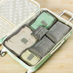 Light Gray packing organizer set inside a suitcase