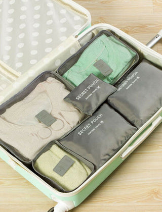 Light Gray packing organizer set inside a suitcase