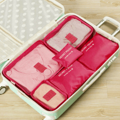 Red packing organizer set inside a suitcase
