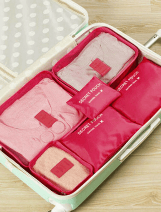 Red packing organizer set inside a suitcase