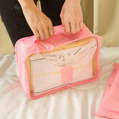 Zip opening on a Pink mesh packing organizer