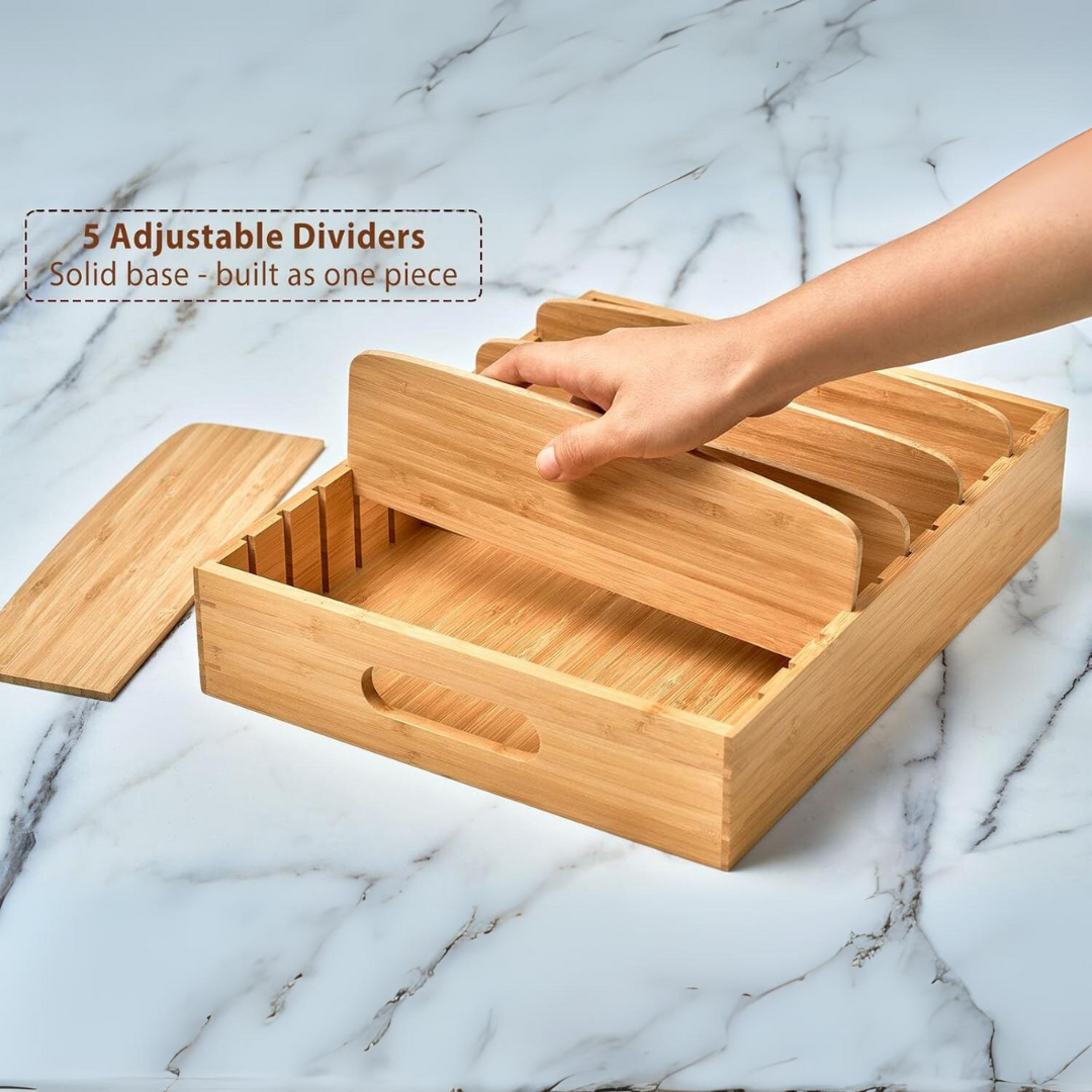 Five adjustable bamboo dividers being repositioned