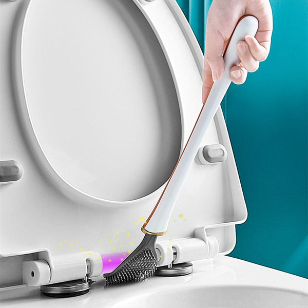 White toilet brush cleaning around the toilet rim