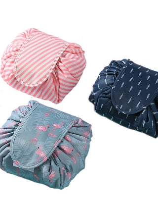 Three drawstring cosmetic bags shown open and gathered
