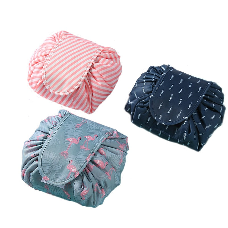 Three drawstring cosmetic bags shown open and gathered