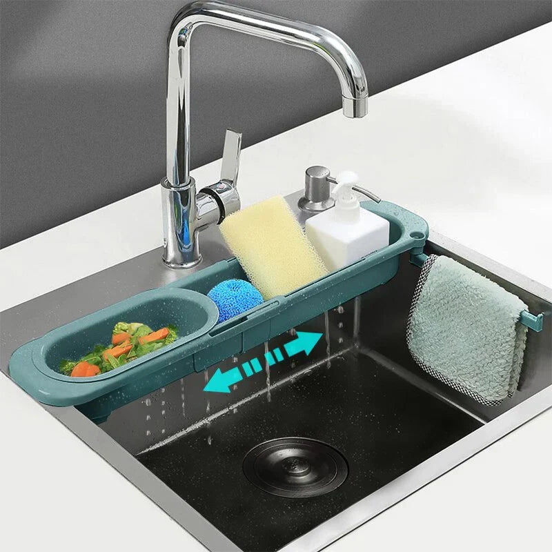 Expandable sink organizer holding produce, soap, and a dishcloth