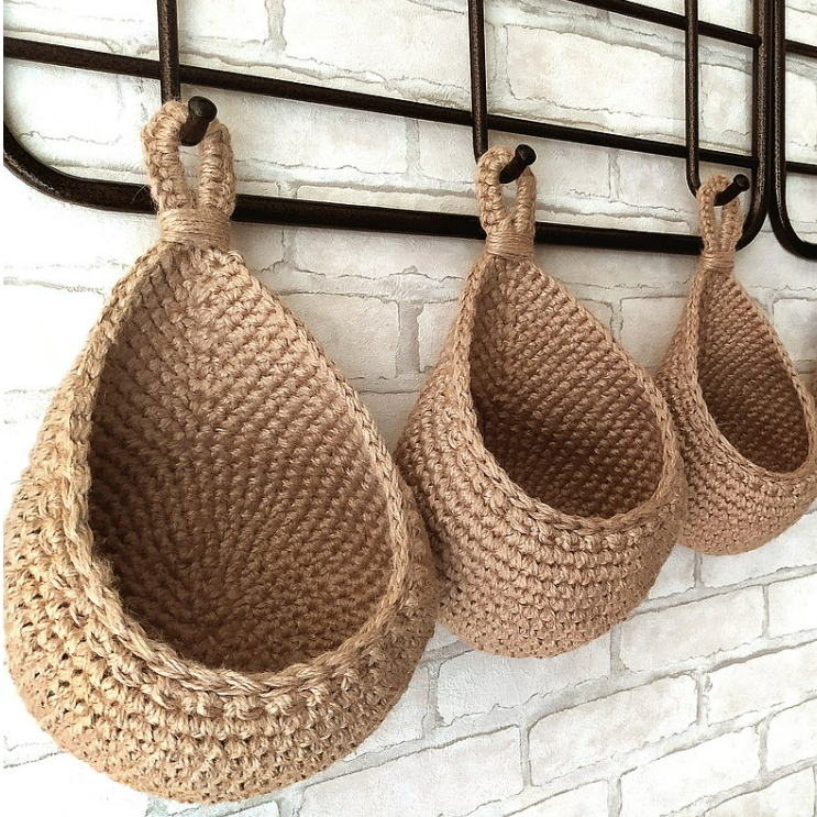 Three cotton-yarn hanging wall baskets shown as a set