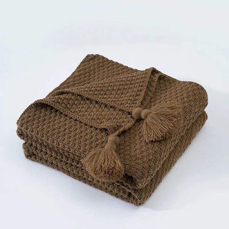 Folded Brown knitted tassel throw