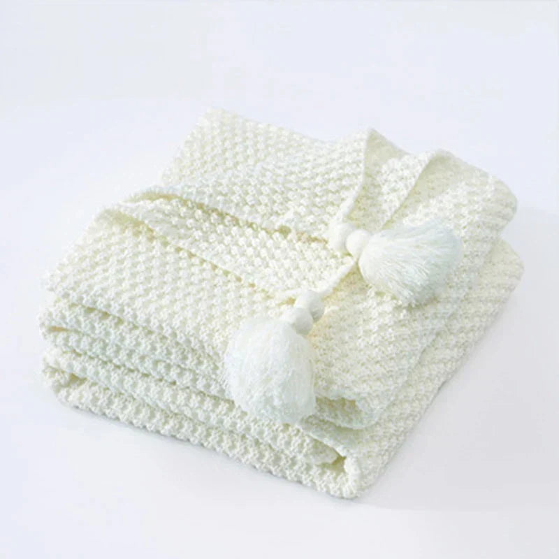 Folded White knitted tassel throw