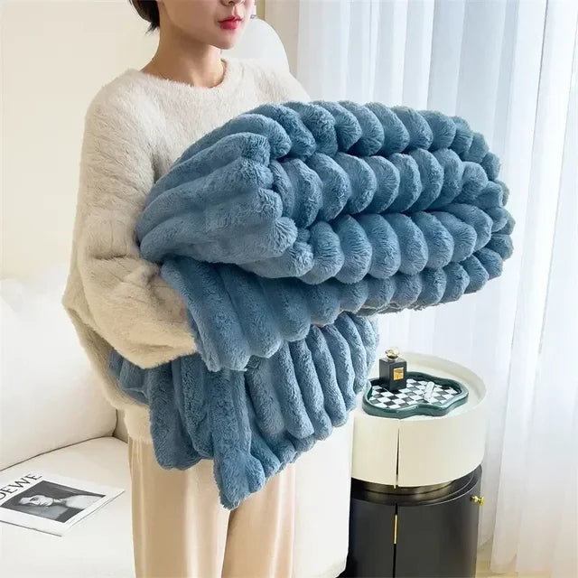 Folded Blue plush ribbed blanket
