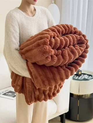 Folded Brown plush ribbed blanket