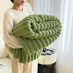 Folded Green plush ribbed blanket