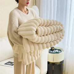 Folded Broken White plush ribbed comfort blanket
