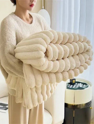 Folded Broken White plush ribbed comfort blanket
