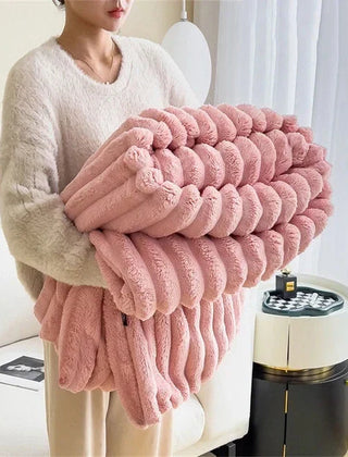 Folded Pink plush ribbed comfort blanket