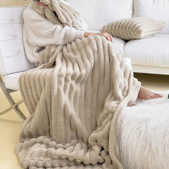 Broken White plush ribbed comfort blanket used on a sofa