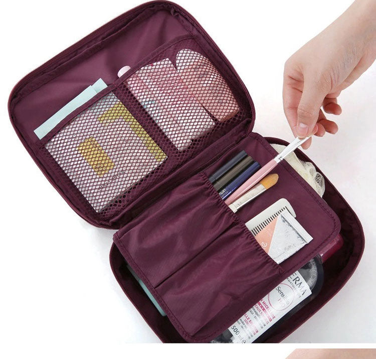 Interior divider and mesh pockets in a makeup organizer