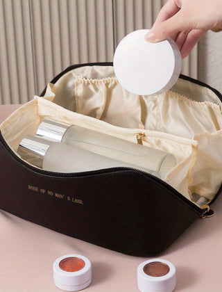 Black toiletry bag with cosmetics in its interior sections