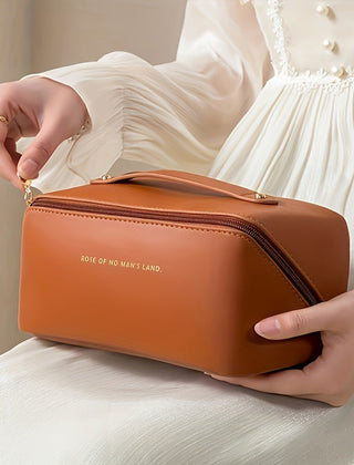 Brown zippered travel toiletry bag