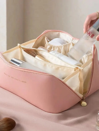 Pink zippered travel toiletry bag shown open